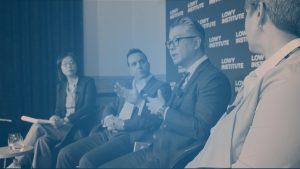 Image of panelists on stage