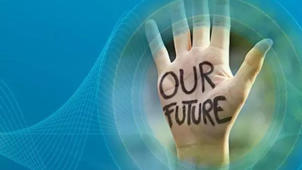 An open hand with Our Future written on the palm in texta