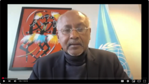 A man speaking on an online workshop session.