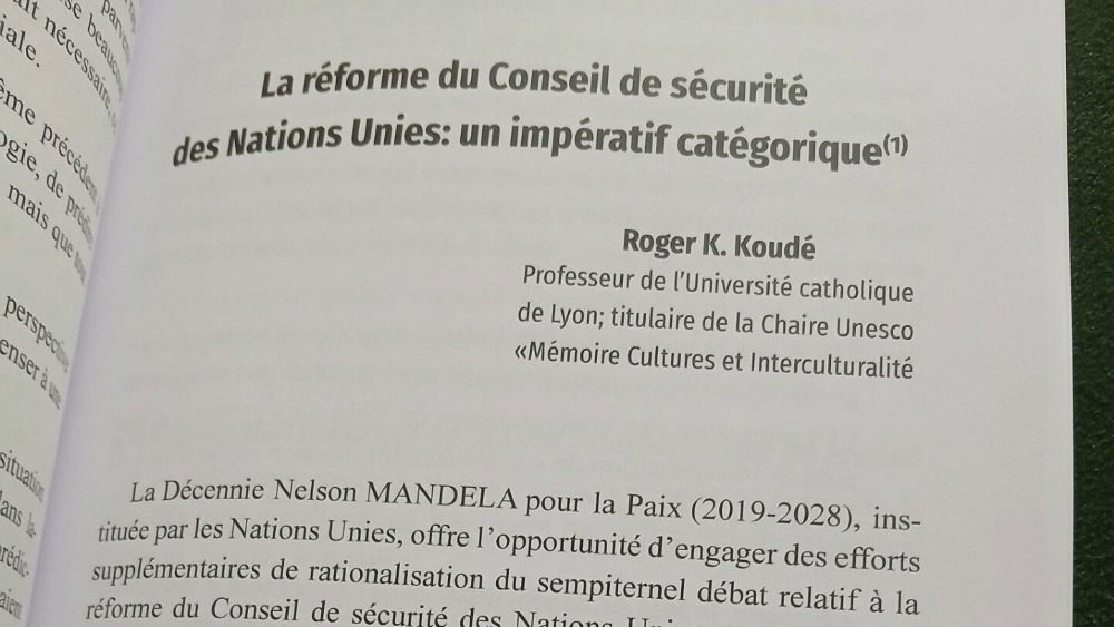 A close-up view of the title page of a chapter on UN reform written by Roger K. Koude, in a book.